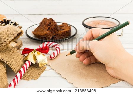 Woman Hand Writing A Letter To Santa Claus