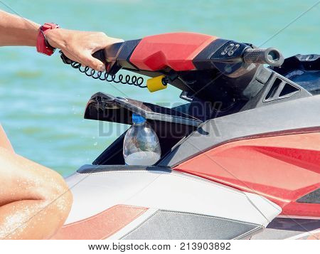 Rudder of a water motorcycle on a beach close up