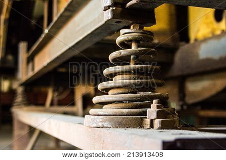 Close up obsolete metal spring on a plant