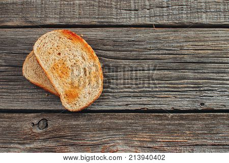 On Wooden Background, On The Boards Of Toasted Bread