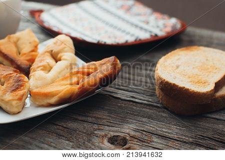 On Wooden Background, On The Boards Of Toasted Bread