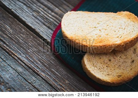On Wooden Background, On The Boards Of Toasted Bread