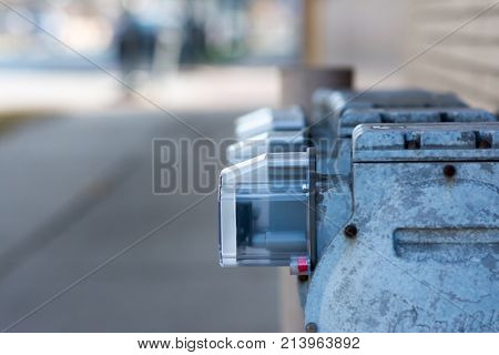 row of utility meters attached to building