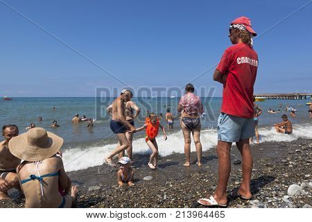 Lazarevskoe, Sochi, Krasnodar region, Russia - July 4, 2014: Lifeguard at central beach in Lazarevsky, Sochi