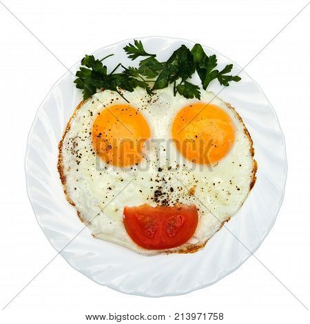 Eggs parsley (vegetables/bread/ketchup) is formed by a funny face on a white plate. The concept of food for children