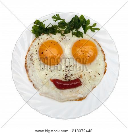 Eggs parsley (vegetables/bread/ketchup) is formed by a funny face on a white plate. The concept of food for children
