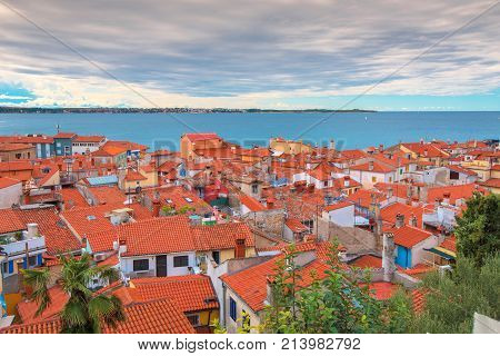 PIRAN SLOVENIA - SEPTEMBER 3 2017: Piran rooftops on sunny summer day. Piran is the administrative centre of Slovenian Istria and one of Slovenia's major tourist attractions.