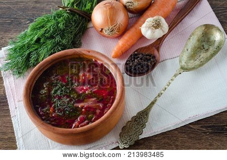 Bowl of traditional soup Borscht on table