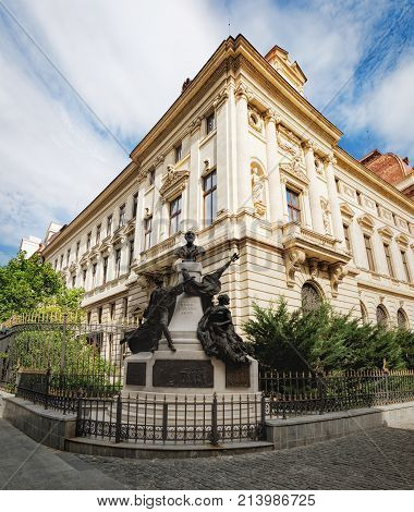 Bucharest, Romania - September 9, 2017: Monument to Eugeniu Carada and the ancient architecture of historical center Lipscani Street in Bucharest, Romania.
