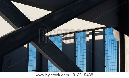 Modern Bracing Of A Concrete Building With Blue Sky In The Background