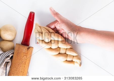 Homemade Food Concept Process Braiding Bread Braid Challah Dough On White Background With Copy Space
