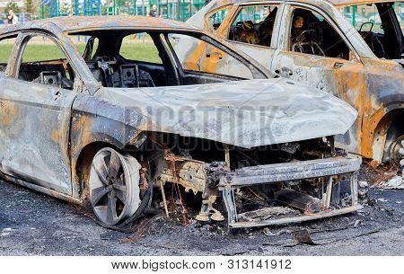 Burnt Car After A Fire, Body Parts Burnt Door Handles And Cracked Glass, The Picture Is Not Pleasant