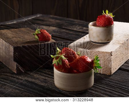Composition On A Wooden, Dark Background, Consisting Of Fresh Strawberries, Which Lies On The Wooden
