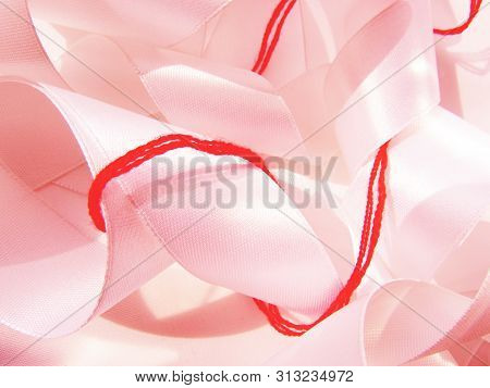 Bright Red Scarlet Wool Thick Thread Wrapped Around A Light Pink Satin Wide Ribbon Chaotic Sewing Ba