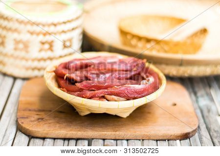 Dried Meat In A Bamboo Dish With Kratib Glutinous Rice, Food Preservation, Thai Traditional Food.