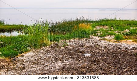 Sandy Beach And Sunset At The Bay