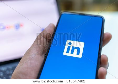 Chiang Mai, Thailand - May.26,2019: Man Holding Xiaomi Mi Mix 3 Mobile Phone With Linkedin Applicati