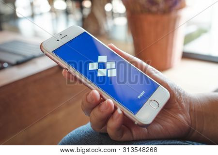 Chiang Mai, Thailand - Apr.27,2019: Woman Holding Apple Iphone 6s Rose Gold With Dropbox On Screen. 