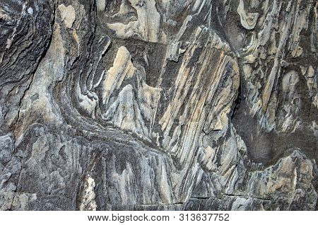 A Cut Of Stone That Looks Like A Mountain Landscape. Background.