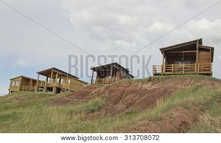 Russia, Republic Of Khakassia, July 2019: Wooden Houses Recreation Bigples On Lake Bele.