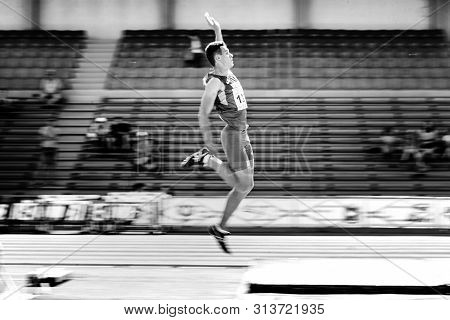 Chelyabinsk, Russia - July 12, 2019: Male Athlete Long Jump Motion Blur During Championship In Athle