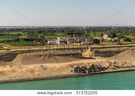 Suez, Egypt - November 5, 2017: Typical Suez Canal Landscape, Farm Land Along The Canal In Egypt, Af