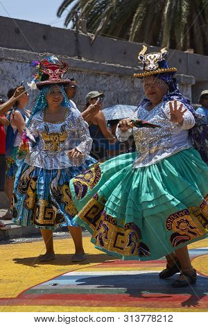 Arica, Chile - February 11, 2017: Members Of A Waca Waca Dance Group In Ornate Costume Performing At