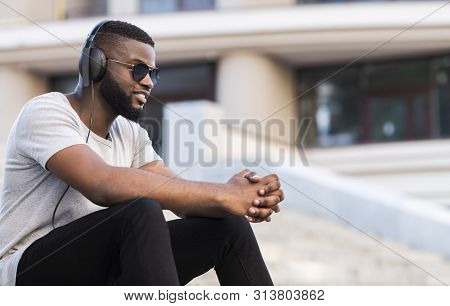 African Guy In Headphones Listening To Music Having Good Mood Outdoor, Copy Spce