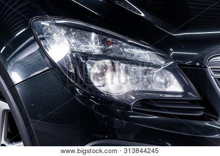 Novosibirsk, Russia - July 08, 2019:  Opel Mokka, Close-up Of The Headlight, Bumper, Wheel. Photogra