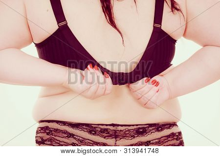 Fat Woman Rear View Opening Taking Off Or Putting On Her Bra. Plus Size Overweight Female Model Wear