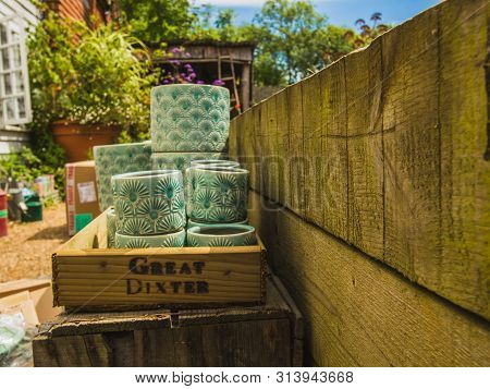Northiam, Great Britain - July 13 , 2017- Ceramic Flower Pots On A Wooden Shelf In Great Dixter, Sum