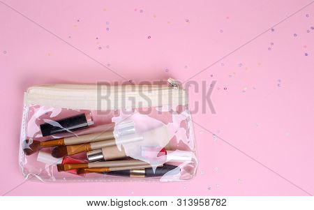 Makeup Professional Cosmetics On Pink Background. Top View With Copy Space.