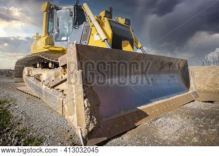 Track Bulldozer On The Construction Site In Dramatic Light Scene. Clearing, Grading, Excavation Of T