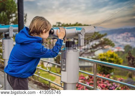 Binoscope. Stationary City Binoculars. A Boy Looks At The City Through A Binoscope