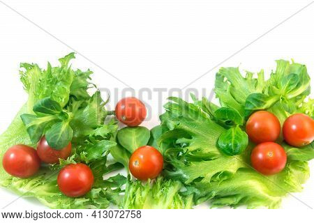 Fresh Vegetables Green Lettuce And Red Cherry Tomatoes.isolated On A White Background.