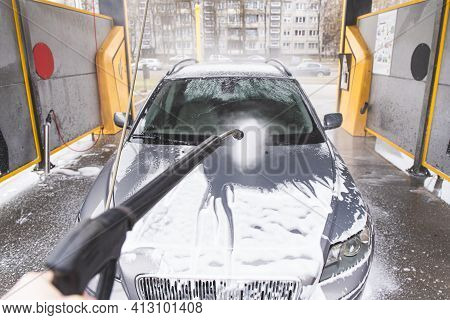 Contactless  Car Wash Self Service System. Washing Dirty Car In Car Wash Station With Foam