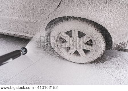 Car Covered With Washing Foam At Contactless Car Washing Service