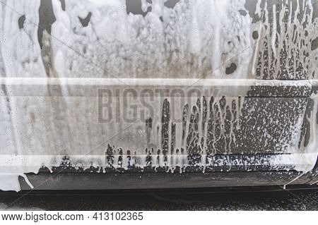 Car Covered With Washing Foam At Contactless Car Washing Service