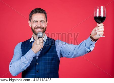 Happy Unshaven Man In Business Casual Style Speak Into Microphone Lifting Glass Of Red Wine, Toaster