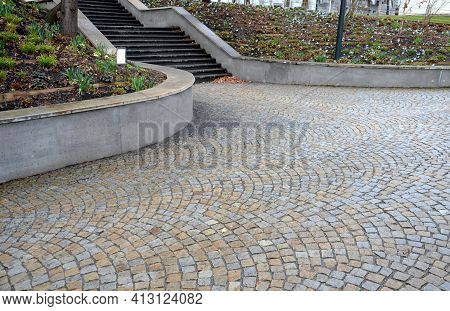 Retaining Wall At The Large Staircase In The Park The Flowerbed Area Is Planted With Rich Greenery O