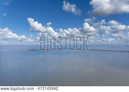 Aerial View Of The Landscape Of The Wadden Sea National Park Near Hooksiel. Hooksiel Is A Holiday Re