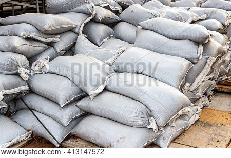 Wall Of Sandbags For Flood Defense Or Military Use Close Up. Heap Of Sacks