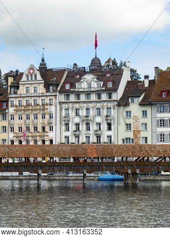 Lucerne, Switzerland - May 20th 2017: Historic Bridge And Facade At The Water