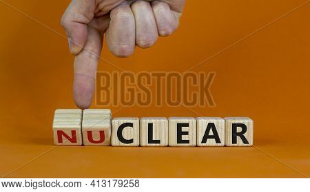 Nuclear Or Clear Symbol. Businessman Turns A Cube And Changes The Word 'nuclear' To 'clear'. Beautif
