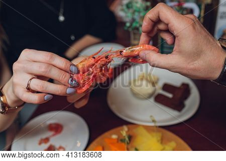 Shrimp With Tomatoes And Feta Cheese On A Plate On A Table Close-up. Horizontal.