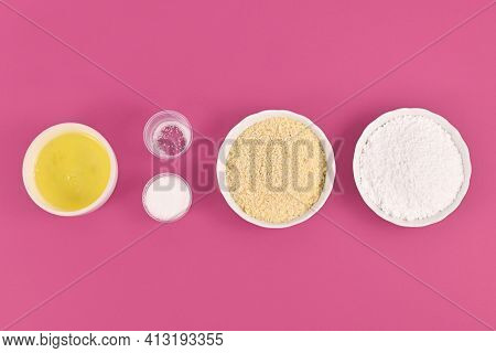 Bowls With Ingredients For Making Homemade French Macaron Sweets Showing Powdered Sugar, Ground Almo