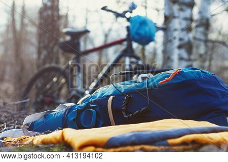 A Portable Charger Charges The Smartphone. Power Bank With Cable Against The Background Of Wood And