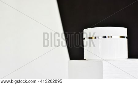 Jar Of Natural Cosmetic Cream Moisturizer On Stand On A White-black Backdround. Mockup. Spa Natural 