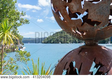Great Barrier Island New Zealand - February 22 2021; Iron Sculpture With Rusty Patina In Wharf Of Po