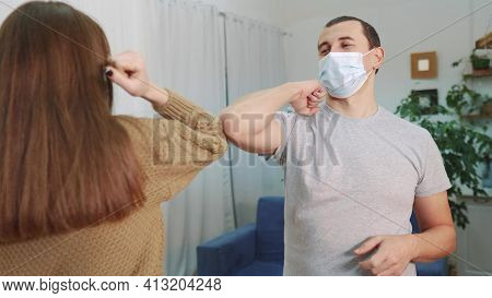 Social Distance. Two Businessmen Touch Elbows. Bump Avoid Greeting. Pandemic Concept. Man And Woman 